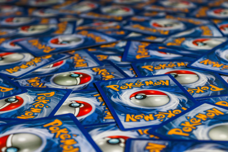 A vibrant display of Pokémon trading cards featuring the iconic Pokeball design.